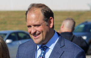 Congressman Andy Barr smiling outside during an event