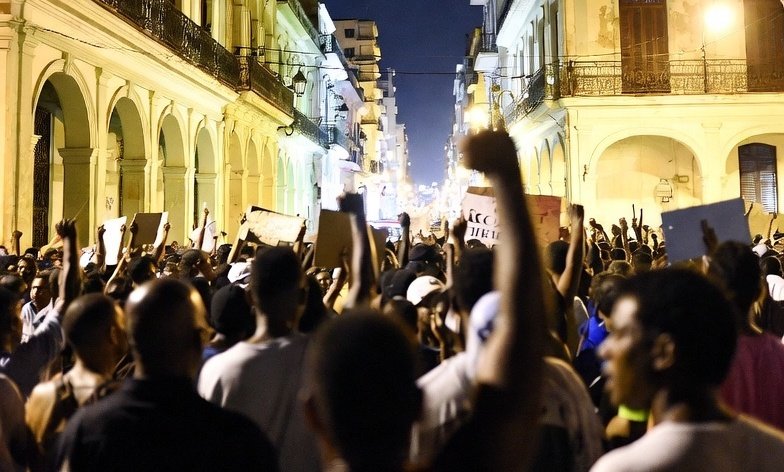 Protest at night in Cuba with many people in the middle of the street