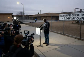 Man holding press conference outside
