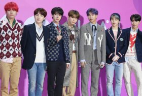 all the members of the BTS boy band posing for a photo