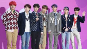 all the members of the BTS boy band posing for a photo