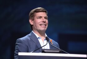Eric Swalwell speaking from a podium