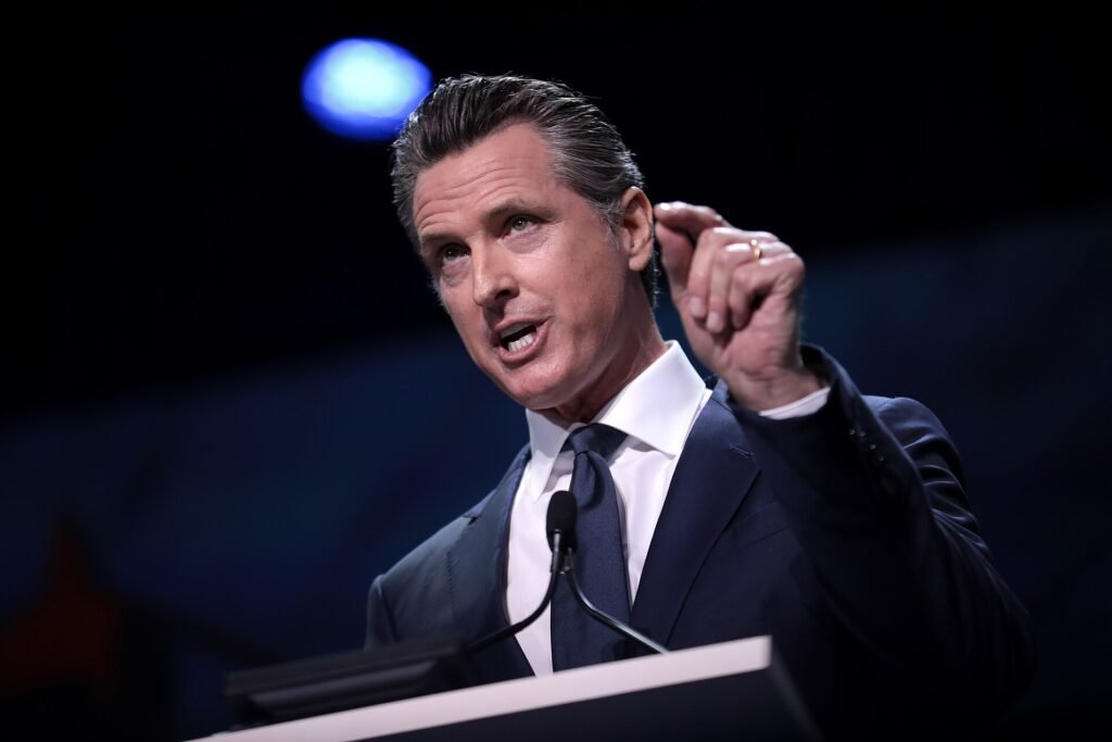 Gavin Newsom speaking from a podium