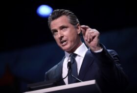 Gavin Newsom speaking from a podium