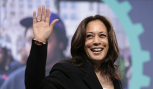 Kamala Harris smiling and waving