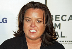 Rosie O'Donnell smiling on the red carpet