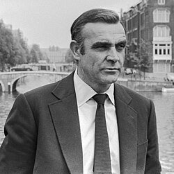 Sean Connery as James Bond with river and bridge in background